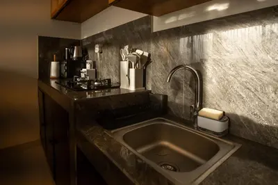a kitchen with a stainless steel sink in a counter at A Better Villa 3BR Seminyak 5min Beach Bintang in Seminyak