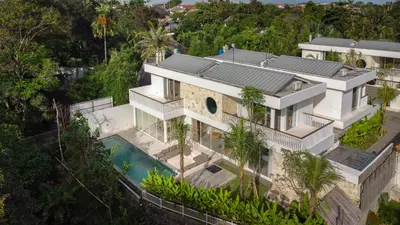 an aerial view of a house with a swimming pool at Villa Tiga by BaliSuperHost in Canggu