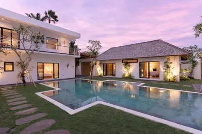an image of a house with a swimming pool at Villa Nador Seminyak in Seminyak