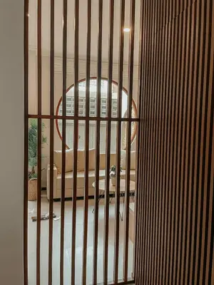 a view of a building through a metal gate at The Maru House in Seminyak