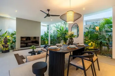 a dining room with a table and chairs at Villa Knack, Seminyak in Kerobokan