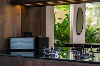 a counter with stools in a hotel lobby at Villa Knack, Seminyak in Kerobokan