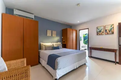 a bedroom with a large bed in a room at Indira Peaceful 1 BR Private Pool Villa in Seminyak