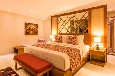 a bedroom with a large bed in a room at Kalyca Stunning 5 BR Private Pool Villa in Jimbaran
