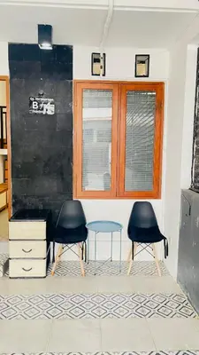 two chairs and a table in a room at Cozy Minimalist Home Near Seminyak & Kuta in Seminyak