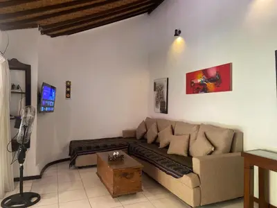a living room with a couch and a table at arjuna house in Seminyak