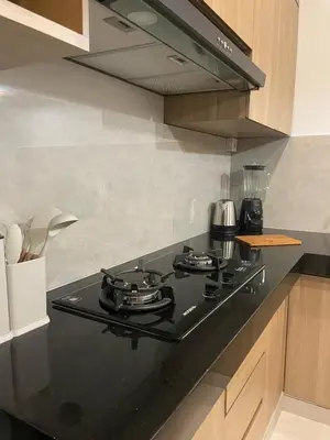 a black stove top oven in a kitchen at Brand new central Villa in Canggu