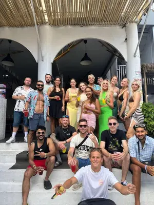 a group of people are posing for a picture at Mycapsule Bali in Seminyak