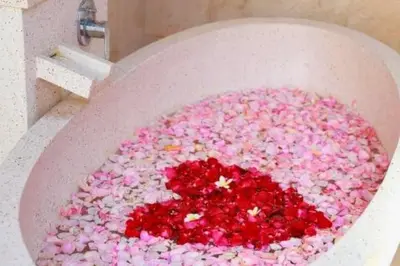 a bath tub filled with pink and red sprinkles at Eksha Comfortable 3 BR Private Pool Villa in Jimbaran