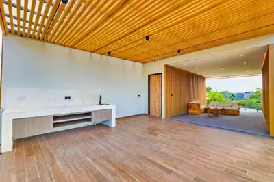 a large living room with a wooden ceiling at Foujina Elegant 4 BR Private Pool Villa in Jimbaran