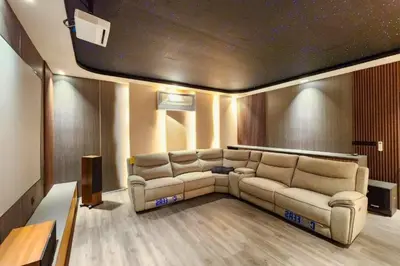 a living room with a couch and a table at Foujina Elegant 4 BR Private Pool Villa in Jimbaran