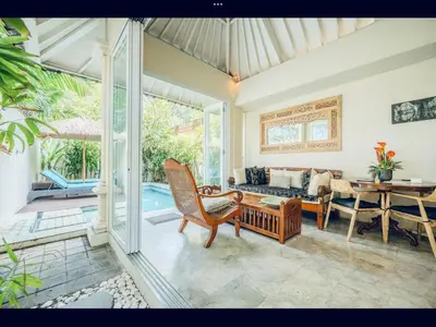 a living room with a couch and a table at Romantic getaway Seminyak in Seminyak