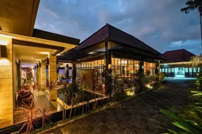 a building with a fence in front of it at Ghania Peaceful 3 BR Private Pool Villa in Jimbaran