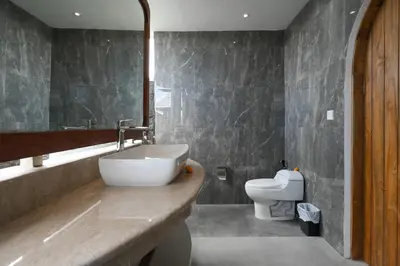 a bathroom with a sink and a toilet at The Wina Villa Canggu by The Wina Resorts in Canggu