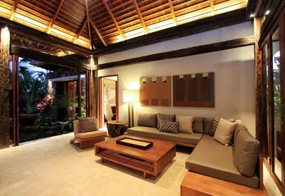 a living room with a couch and a coffee table at Villa Suar Drupadi in Seminyak