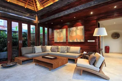 a living room with a couch and a coffee table at Villa Suar Drupadi in Seminyak