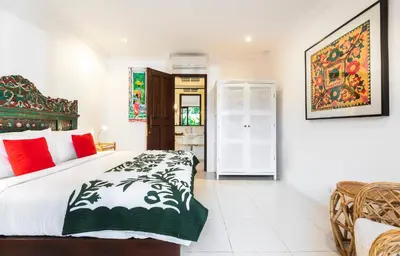 a bedroom with a king sized bed in a room at Villa Atma 2BR Fully Equipped Kitchen in Seminyak