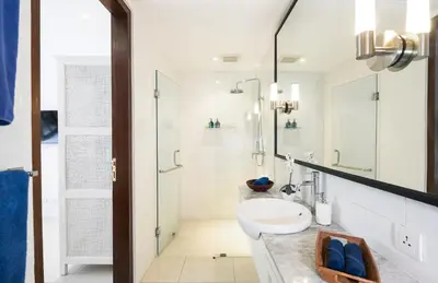 a bathroom with a sink and a shower at Villa Atma 2BR Fully Equipped Kitchen in Seminyak