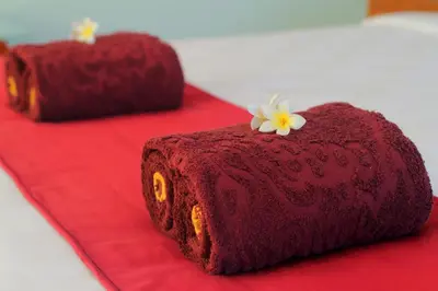 a red cake sitting on top of a red table at Benoa Rose Residence One in Nusa Dua