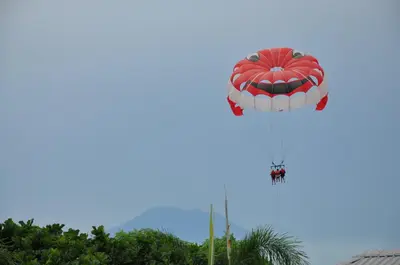 a red and white hot air balloon in the sky at Benoa Rose Residence One in Nusa Dua