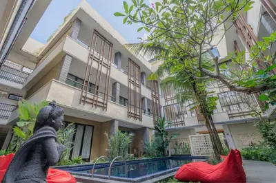 a statue of a woman in front of a building at Swiss-Belinn Seminyak in Seminyak