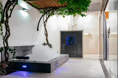 a bathroom with a bath tub in a room at Kamil Villas in Seminyak