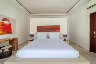 a bedroom with a large white bed in a room at Gorgeous Tropical 3 Bed Pool Villa, 24hr Security in Seminyak