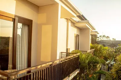 a balcony of a house with plants on it at Room Valka Bali Seminyak in Seminyak