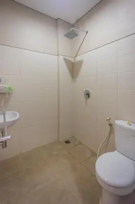 a bathroom with a toilet and a sink at Room Valka Bali Seminyak in Seminyak
