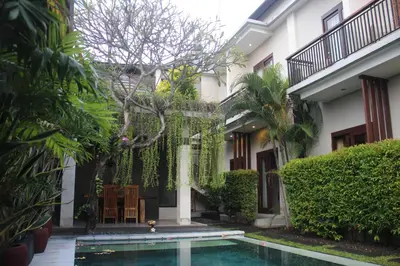 a courtyard of a house with a swimming pool at Room Valka Bali Seminyak in Seminyak