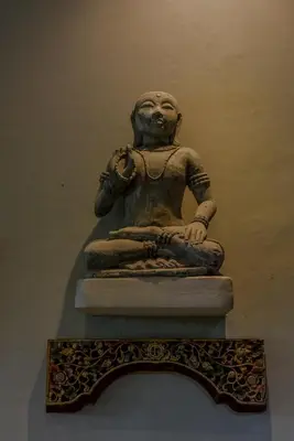a statue sitting on top of a wall at Ben Bali Villa in Seminyak