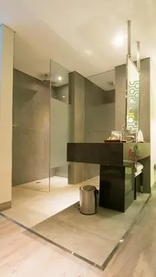 a bathroom with a sink and a counter at Hotel Daun Bali Seminyak in Seminyak