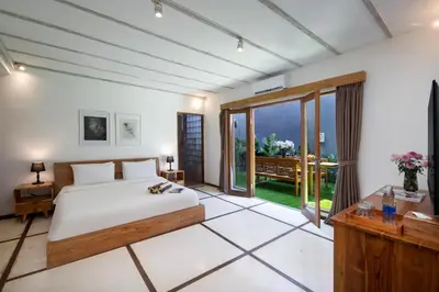 a bedroom with a bed and a large window at Best Location, 9 Bedr Pool Villa, Close To Beach in Seminyak