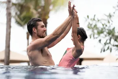 a man and a woman in the swimming pool at Holiday Inn Resort Bali Nusa Dua by IHG in Nusa Dua