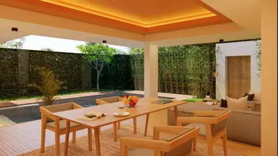 a dining room with a table and chairs at Bvilla Spa in Seminyak