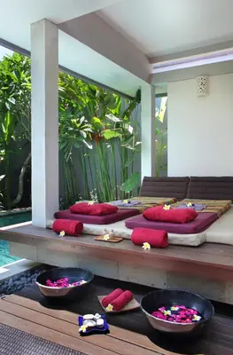 a room with several beds with red pillows on them at Aria Exclusive Villas & SPA in Seminyak