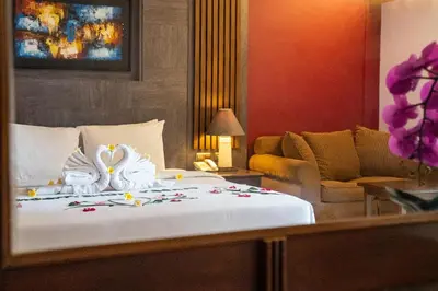 a hotel room with a bed with towels on it at Risata Bali Resort & Spa in Kuta