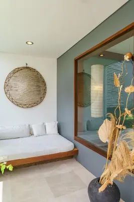 a bedroom with a bed and a mirror at Villa Rio - Contemporary 2BR Villa in Downtown Seminyak in Seminyak