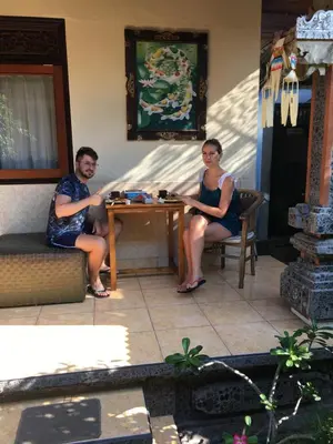 a man and a woman sitting at a table at Nadialit in Seminyak