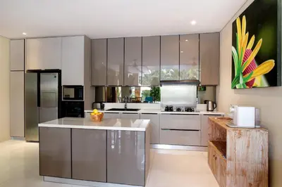 a kitchen with stainless steel appliances and a counter at Villa J Deluxe in Canggu
