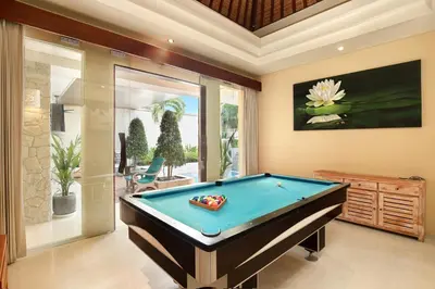 a room with a pool table in a house at Villa J Deluxe in Canggu