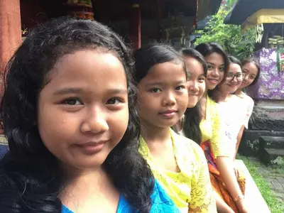 a group of young girls posing for a picture at Puri Kutat Lestari in Sanur