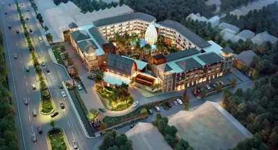 an overhead view of a building with a parking lot at Golden Tulip Jineng Resort Bali in Kuta