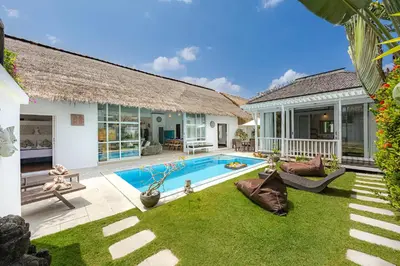 a house with a swimming pool in the yard at Villa Blue Pearl by Optimum Bali Villas in Seminyak
