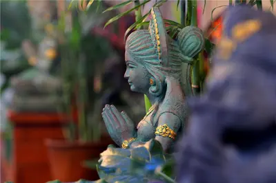 a statue of a woman with tattoos on it at Sleepwell Seminyak in Seminyak