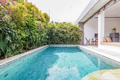 a swimming pool in the backyard of a house at Adorable 1BR villas in the heart of Seminyak in Seminyak