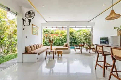 a living room with a couch and a table at Adorable 1BR villas in the heart of Seminyak in Seminyak