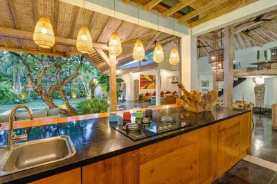a kitchen with a sink and a counter top at Villa Cinta Damai - Stunning & Stylish 4BR Luxury Villa in the Heart of Seminyak, Just a 10-Min Walk to the Beach in Seminyak