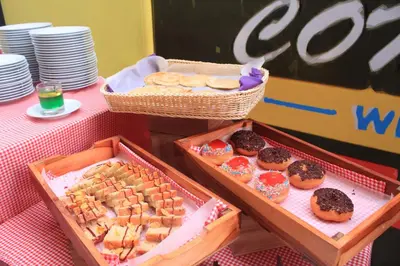 two boxes of donuts and pastries on a table at Fame Hotel Sunset Road in Kuta