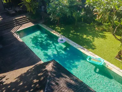 an overhead view of a pool with a toy boat in it at Jadine Bali Villa by Nagisa Bali in Canggu
